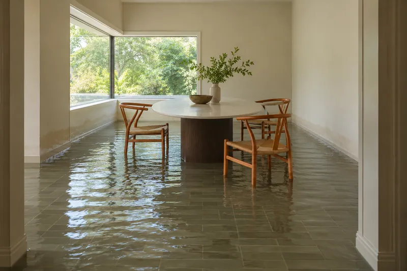 Water Extraction Near Brown House — visible waterlines and submerged furniture feet